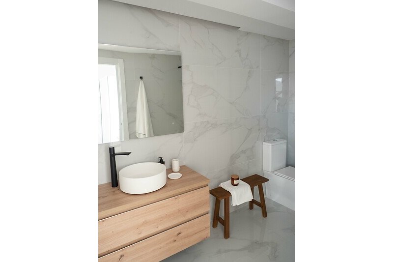 A stylishly designed ensuite bathroom and elegant interior.