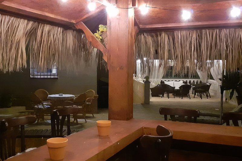 The cozy tiki bar in the evening