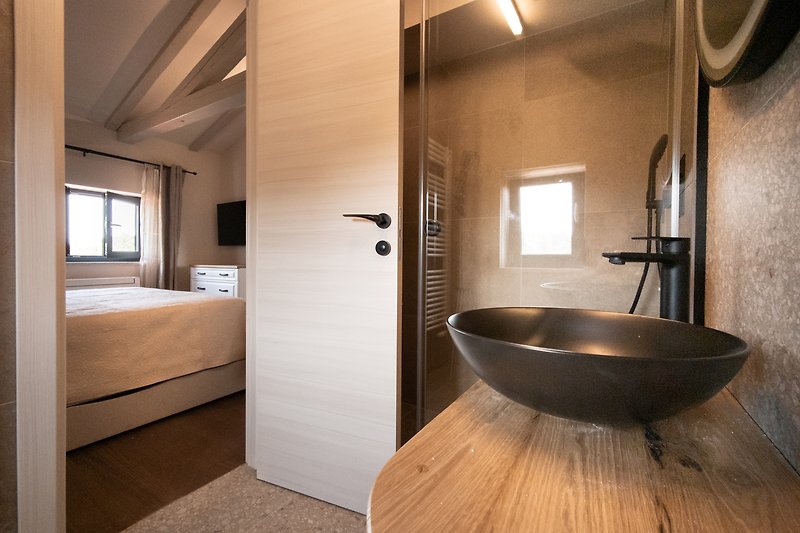 Modern bathroom with sleek fixtures and elegant design.