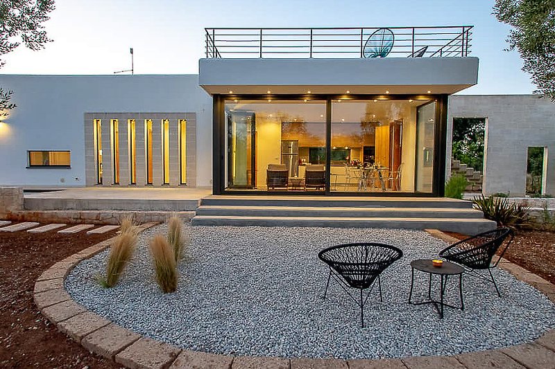 Stylish urban retreat with modern design and outdoor seating.