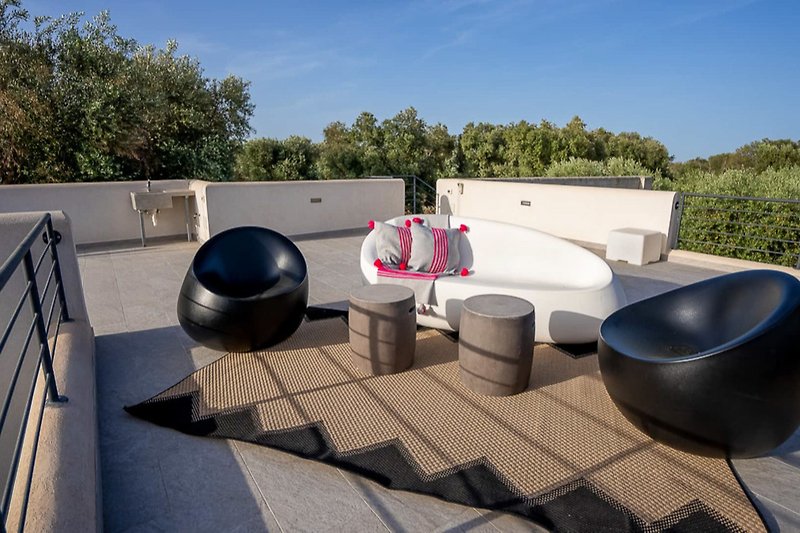 Luxury urban living with modern design and outdoor seating.