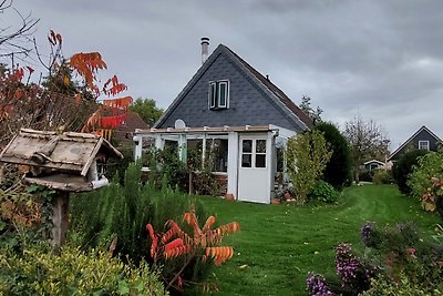 Grünes Haus mit Wintergarten