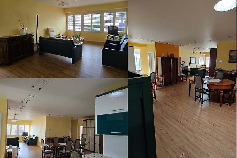 Gemütliches Wohnzimmer mit Holzboden, Couch und Tagesbett.