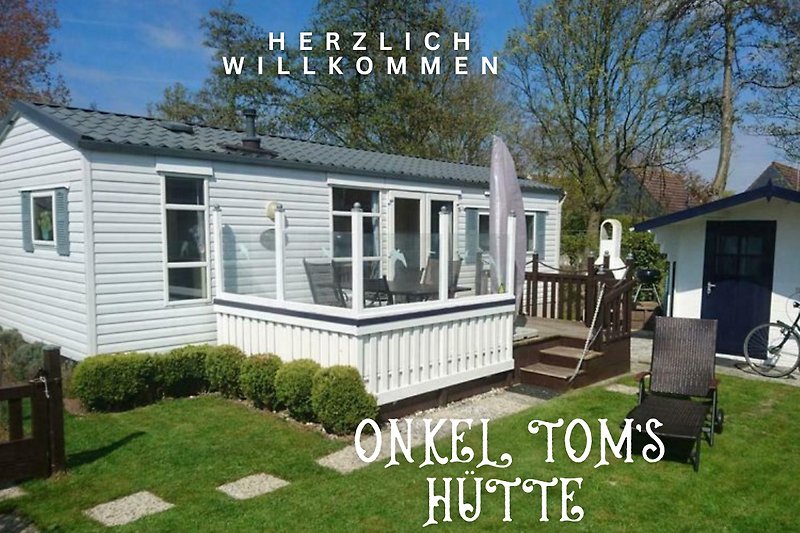 Gemütliches Ferienhaus mit Garten, Veranda und schöner Landschaft. Komplett eingezäunt perfekt für den Urlaub mit Hund.