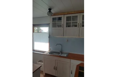 Ferienhaus am Wasser mit Boot und Whirlpool