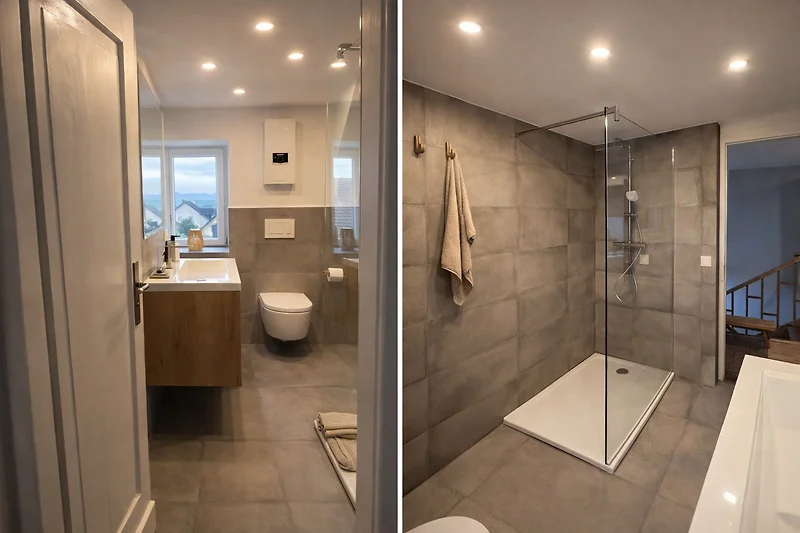 Hochwertiges Bad mit Badewanne, Dusche, Bidet und großem Spiegel.