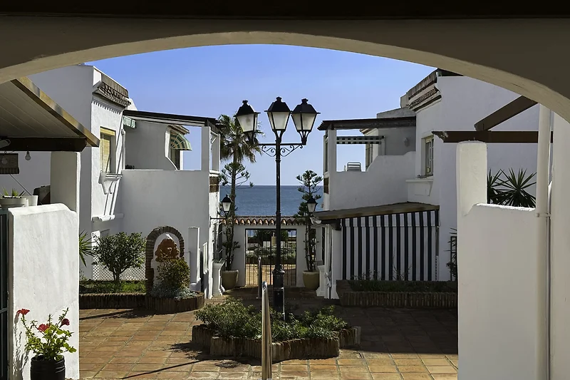 Peaceful gated community with tropical gardens, a communal swimming pool, and direct access to the park and beach.
