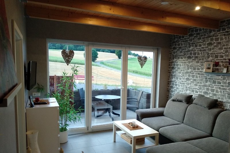 Living room with terrace and view of the fields