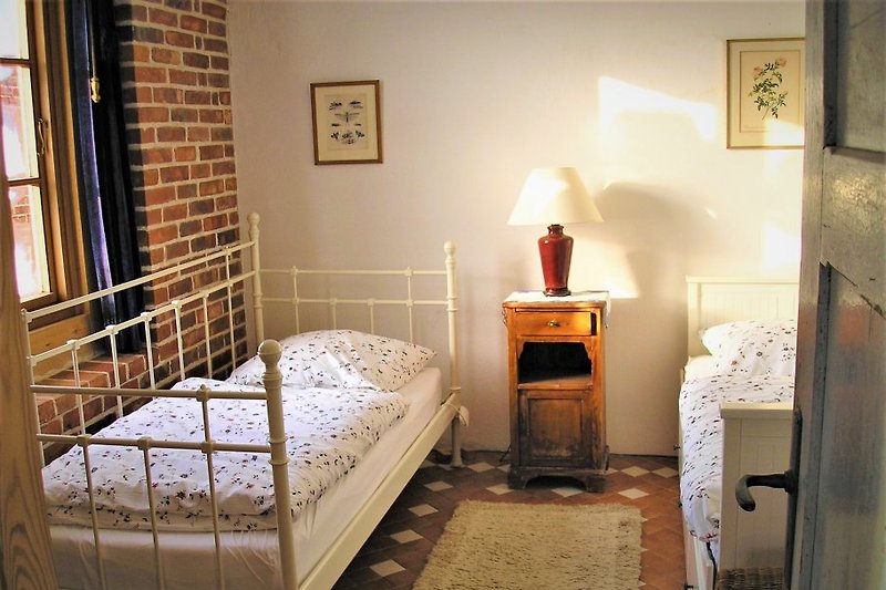 The bedroom with two separate beds.
