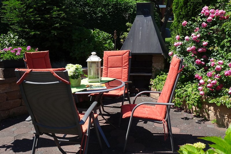 Eifel vacation, seating and barbecue area in the guest garden.