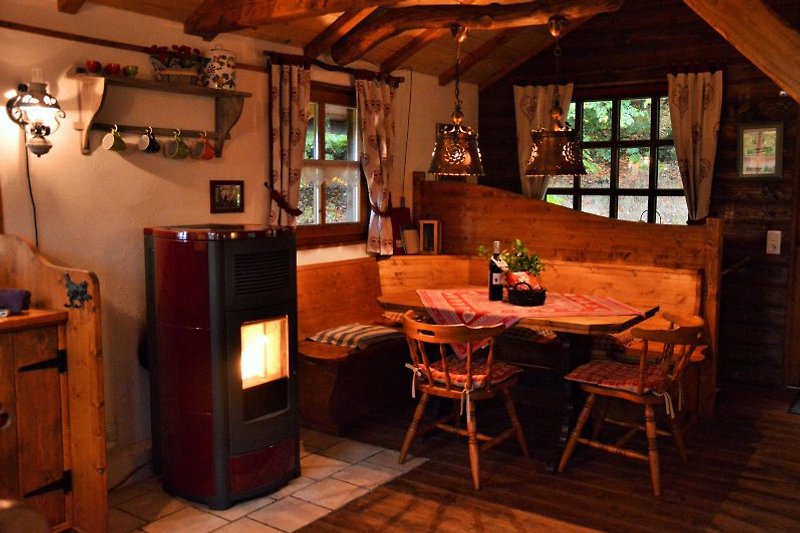 Cozy dining area by the stove.