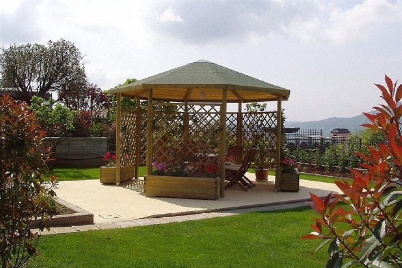 gazebo with targe table and chairs. Barbeque also availabe