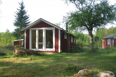 Maison de vacances au bord du lac avec sauna, bateau