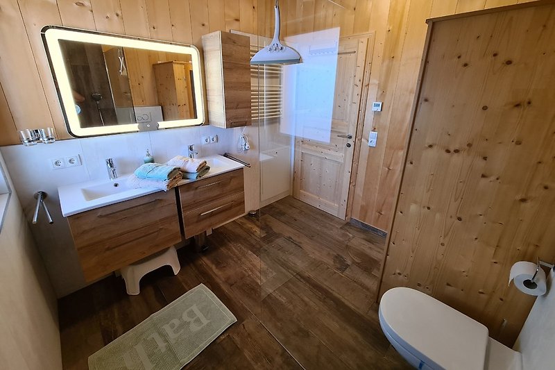 Bathroom with double sink and toilet
