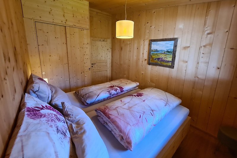 Bedroom with swiss pine wall