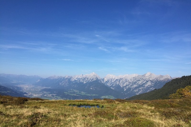 Hiking on Kellerjoch with view to Inntal
