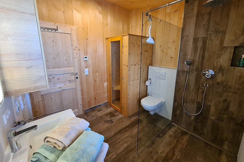 Bathroom with walk-in shower and infrared cabin