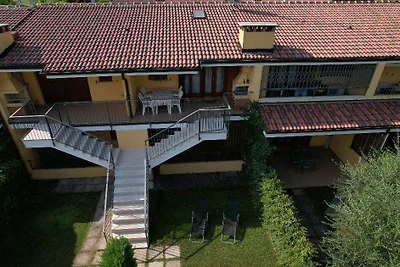 Appartamento C 46 al primo piano, con giardino e piscina