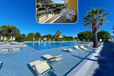Appartamento C 46 al primo piano, con giardino e piscina