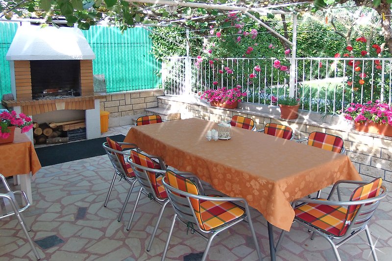 Larger terrace in the garden with grill