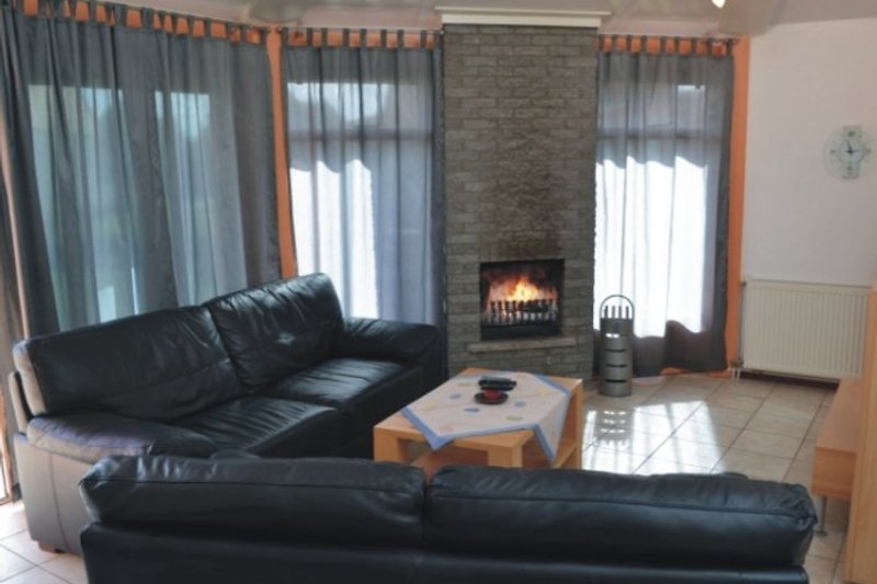 Living room with open fireplace