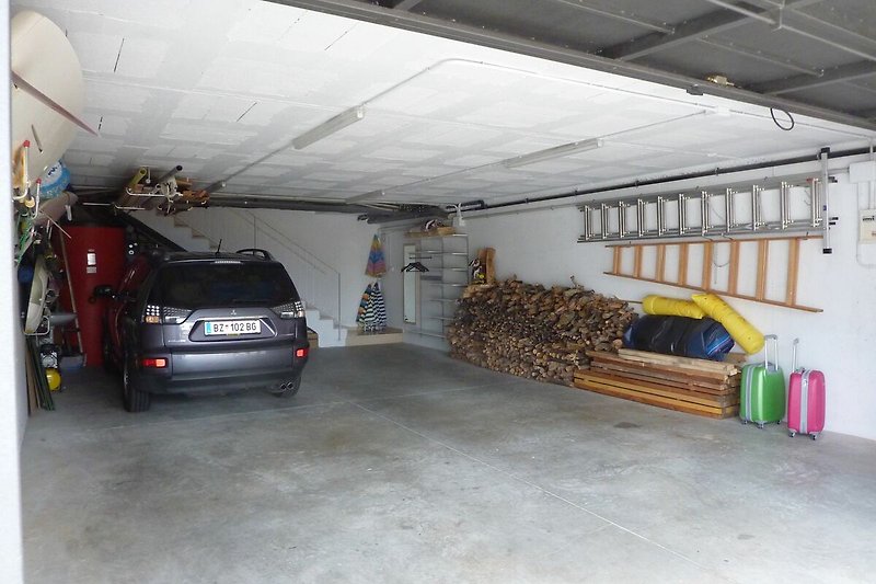 Large garage with electr. door with remote control,  air-compressor and comfortable direct access to living-room
