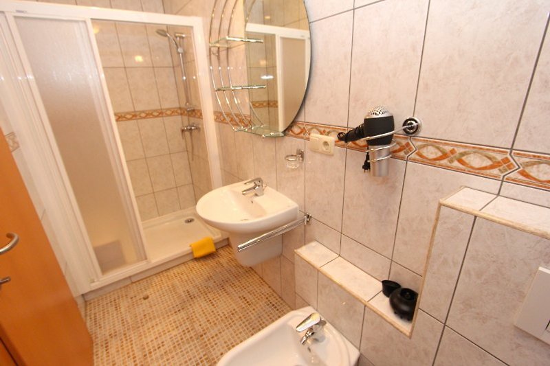 Bathroom with shower, accessible from the bedroom.