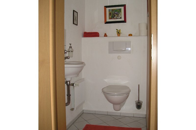 A guest toilet opposite the bedroom.