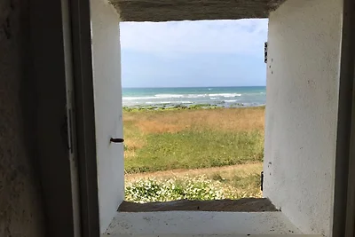 Casa del pescatore in riva al mare