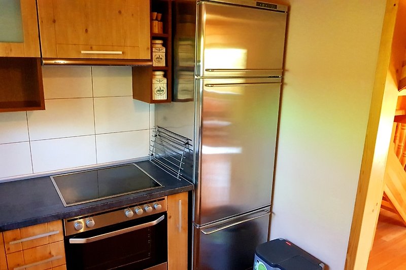 Refrigerator and freezer combination with beverage cooler.