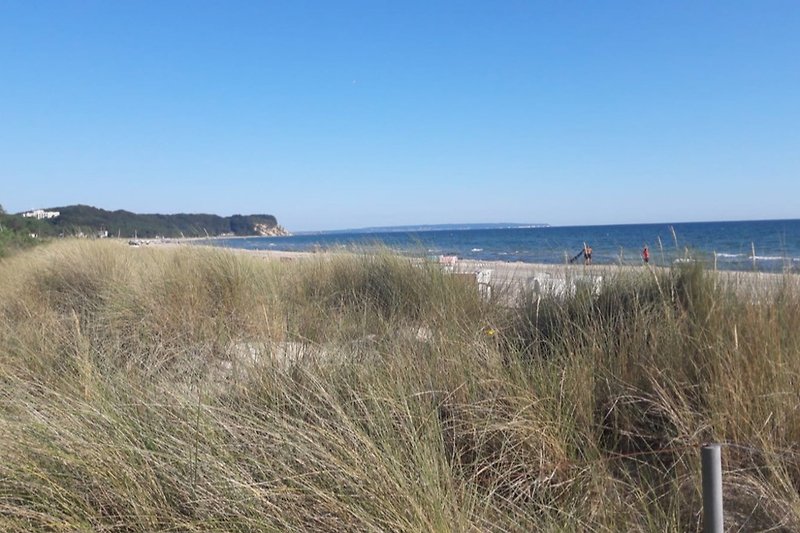 Beach in front of a house with a view of Baabe towards the Baltic Sea resort of Sellin.