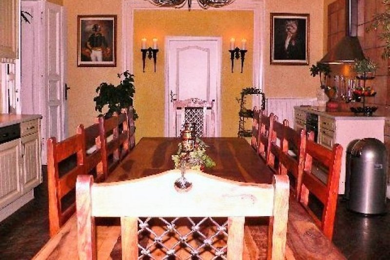 Country house kitchen with 12 chairs.