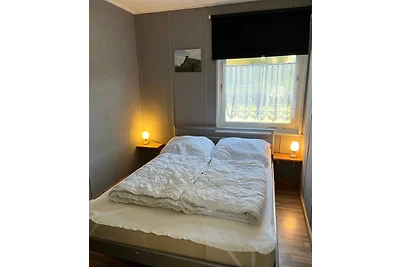 Bungalow mit Boot und Steg