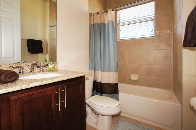 1. Guest bathroom with shower tub.